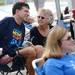 Bob Schoeni chats with a supporter as they sit poolside while the Buhr Park Shark swimmers participate in a swimathon to raise funds for Ann Arbor Active Against ALS and Schoeni at the Buhr Park Pool on Wednesday morning. Melanie Maxwell | AnnArbor.com